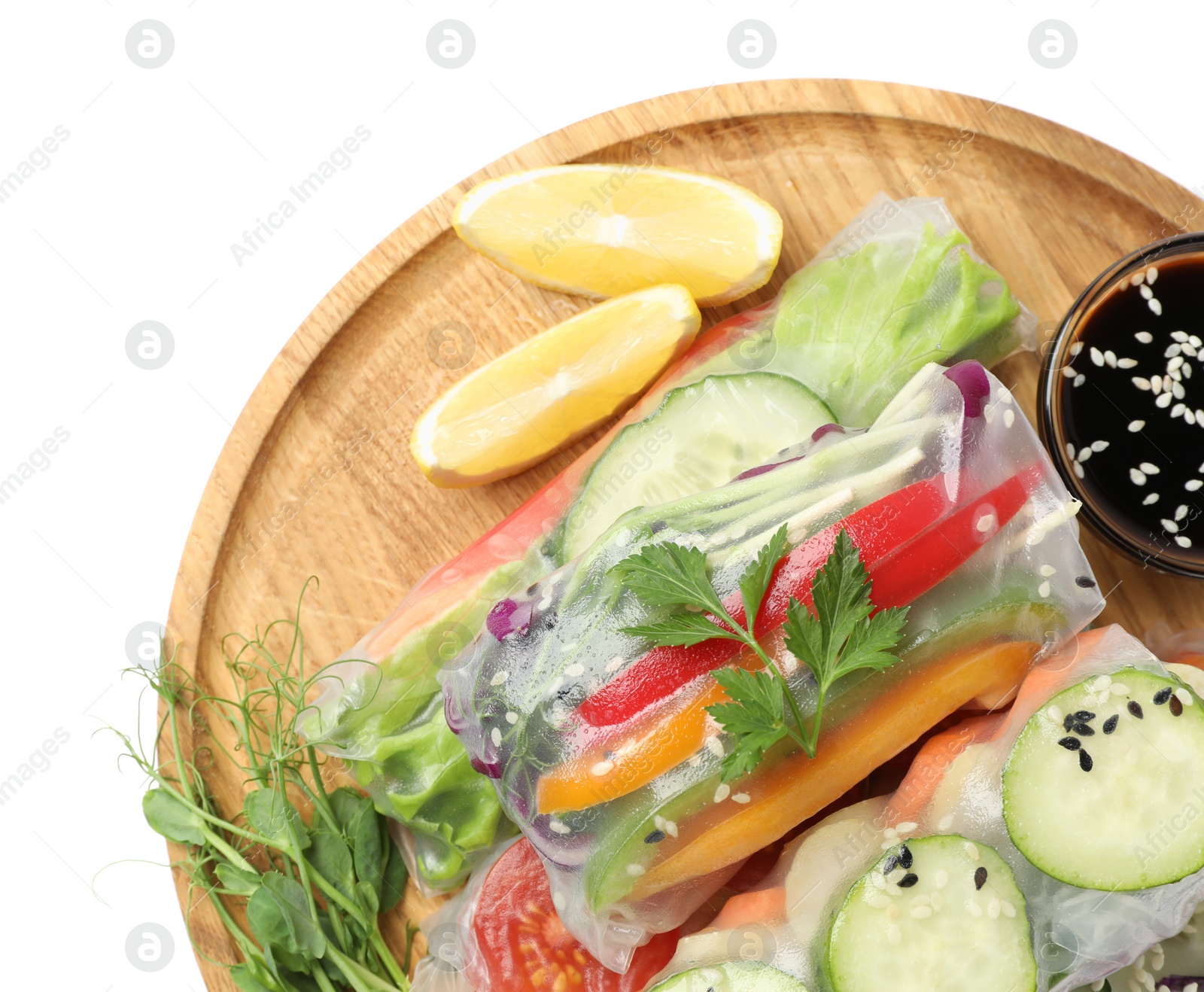 Photo of Many different delicious rolls wrapped in rice paper and soy sauce isolated on white, top view