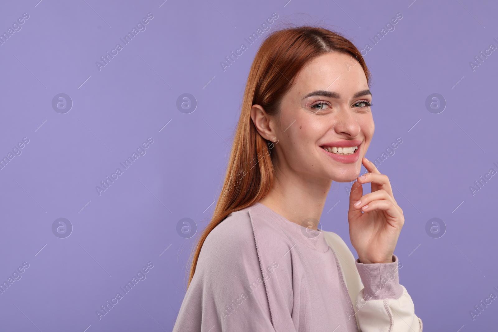 Photo of Beautiful woman with clean teeth smiling on violet background, space for text