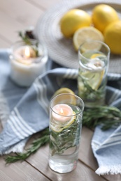 Natural homemade mosquito repellent candles on wooden table in room