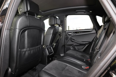 Photo of Inside of modern car with black leather seats