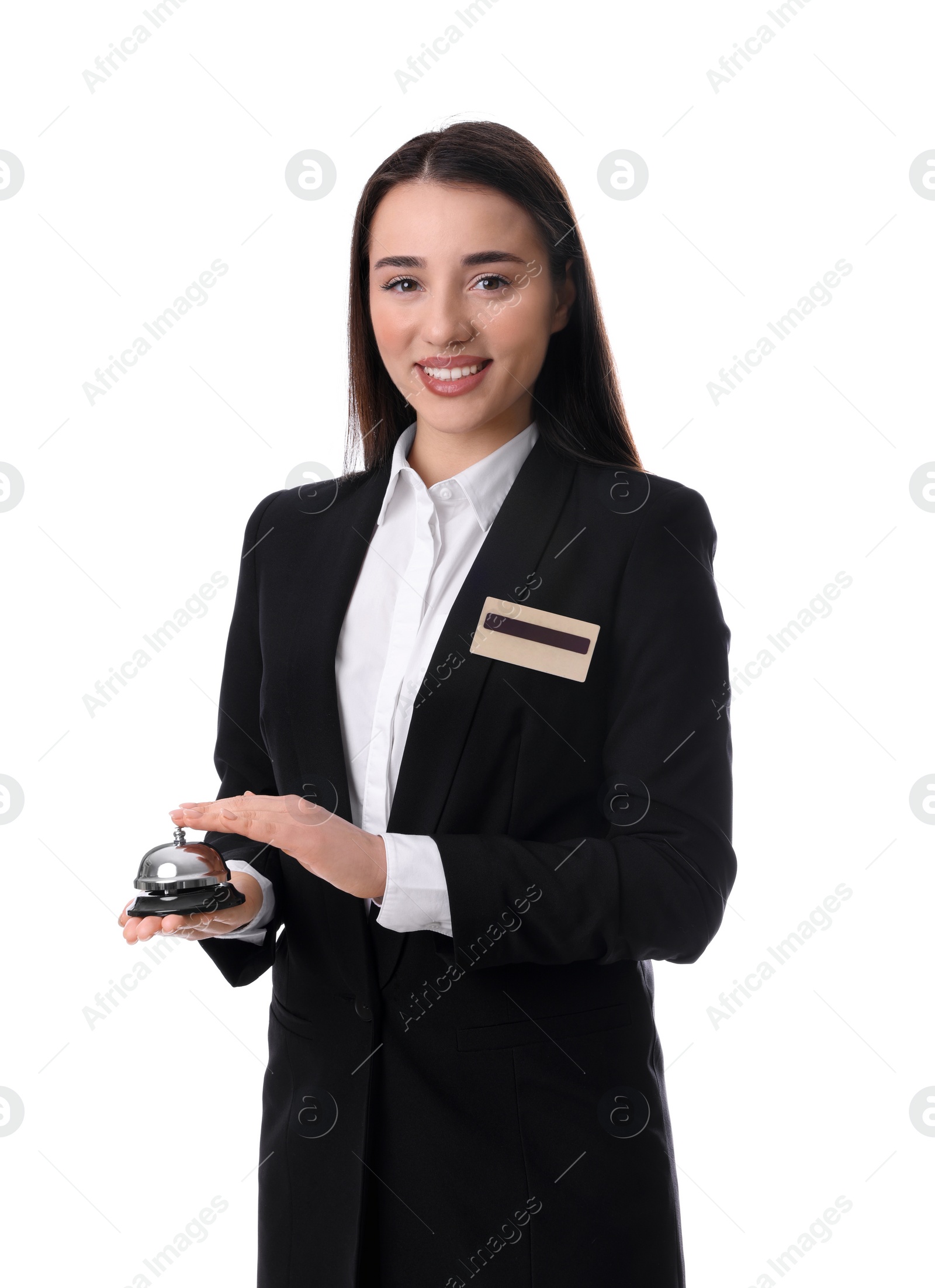 Photo of Happy young receptionist in uniform holding service bell on white background