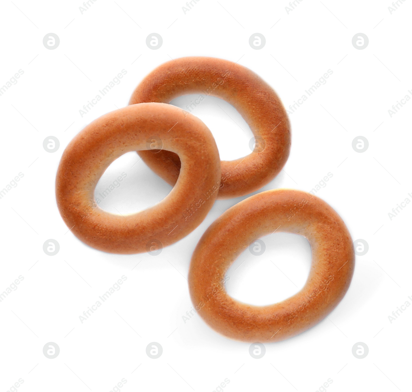 Photo of Tasty dry bagels (sushki) isolated on white, top view