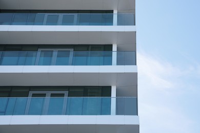 Photo of Exterior of residential building with balconies, low angle view