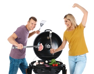 Photo of Happy couple cooking on barbecue grill, white background