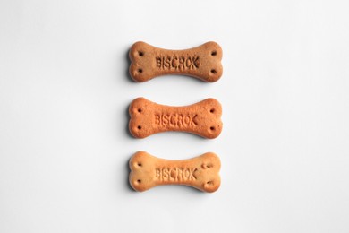 Bone shaped dog cookies on white background, top view