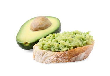 Delicious sandwich with guacamole and half of avocado on white background