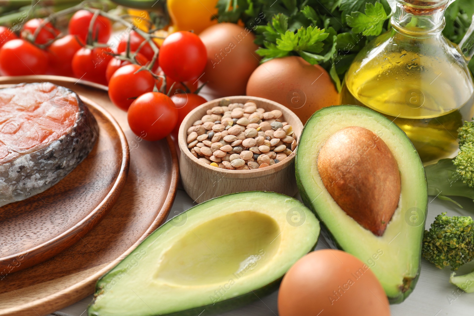 Photo of Many different healthy food on white table, closeup