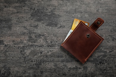 Leather wallet with credit card on table