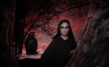 Image of Mysterious witch with raven  in dark forest. Fantasy world