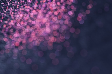 Photo of Magic pink bokeh effect on dark background