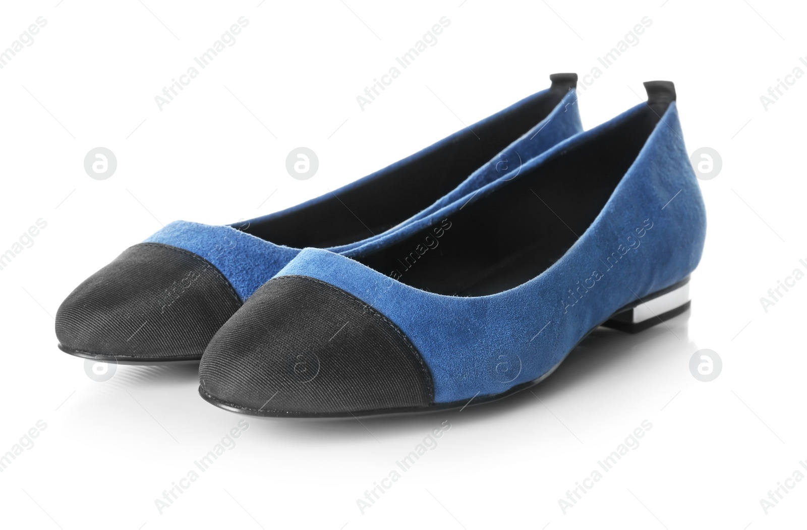 Photo of Pair of female shoes on white background