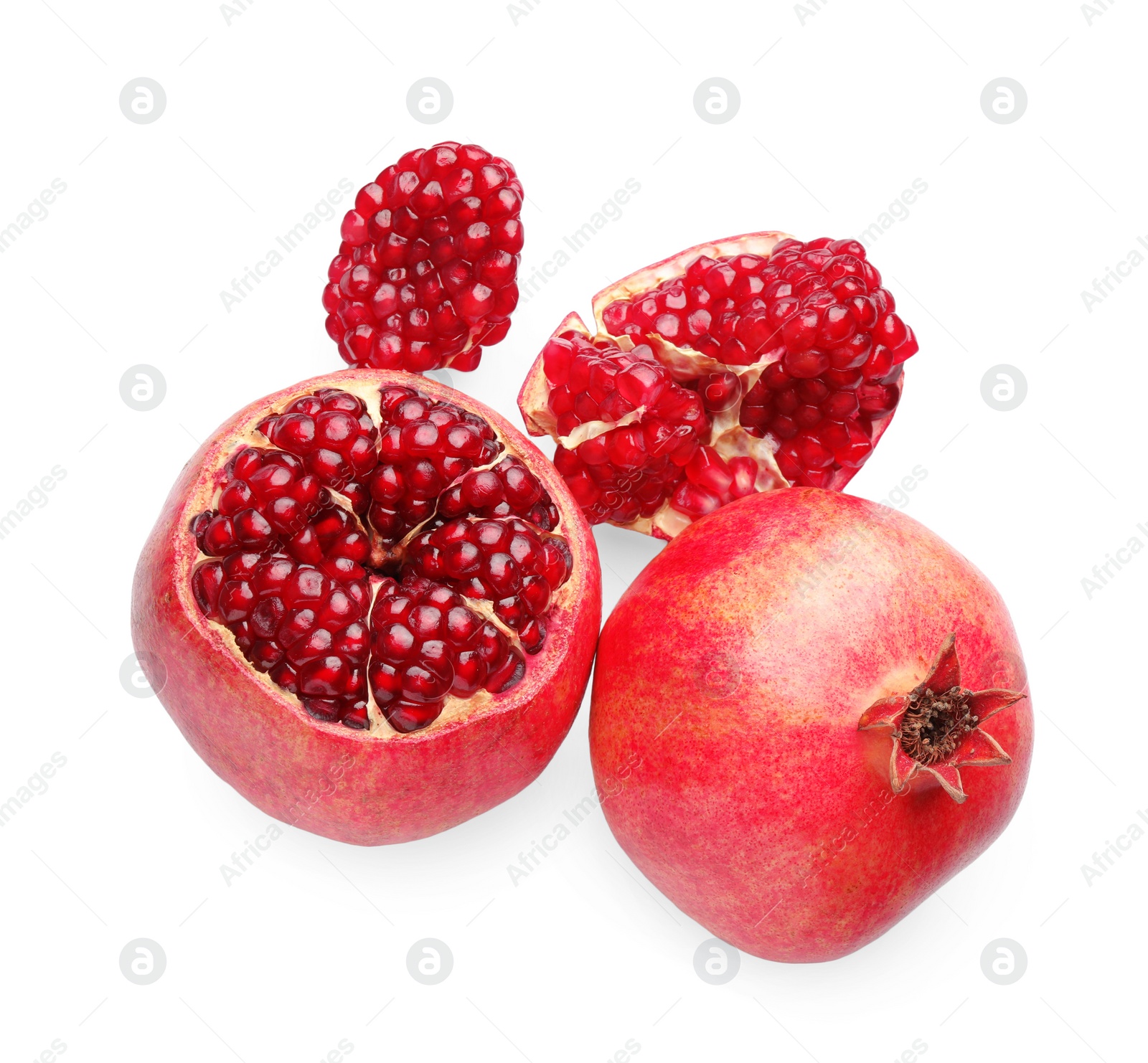 Photo of Whole and pieces of fresh pomegranates isolated on white, top view