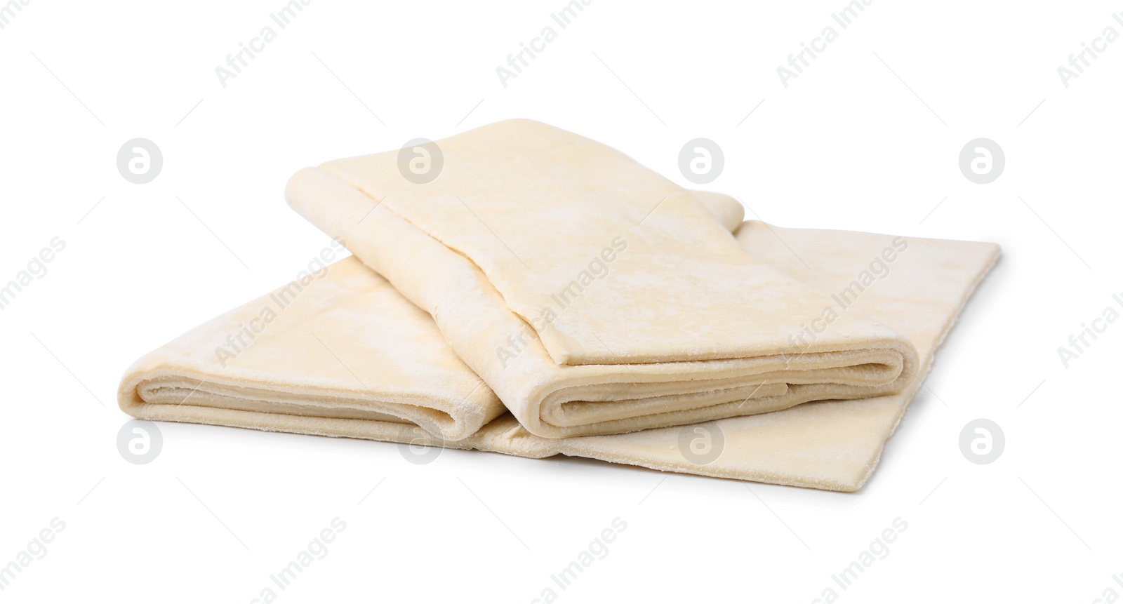 Photo of Raw puff pastry dough isolated on white