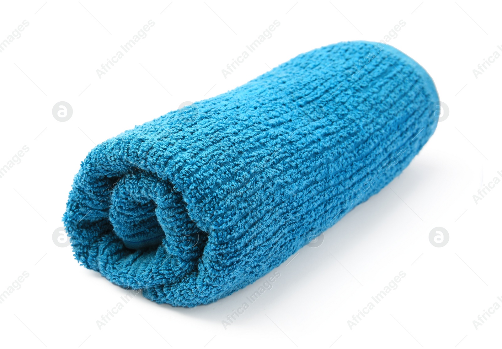 Photo of Rolled blue terry towel isolated on white