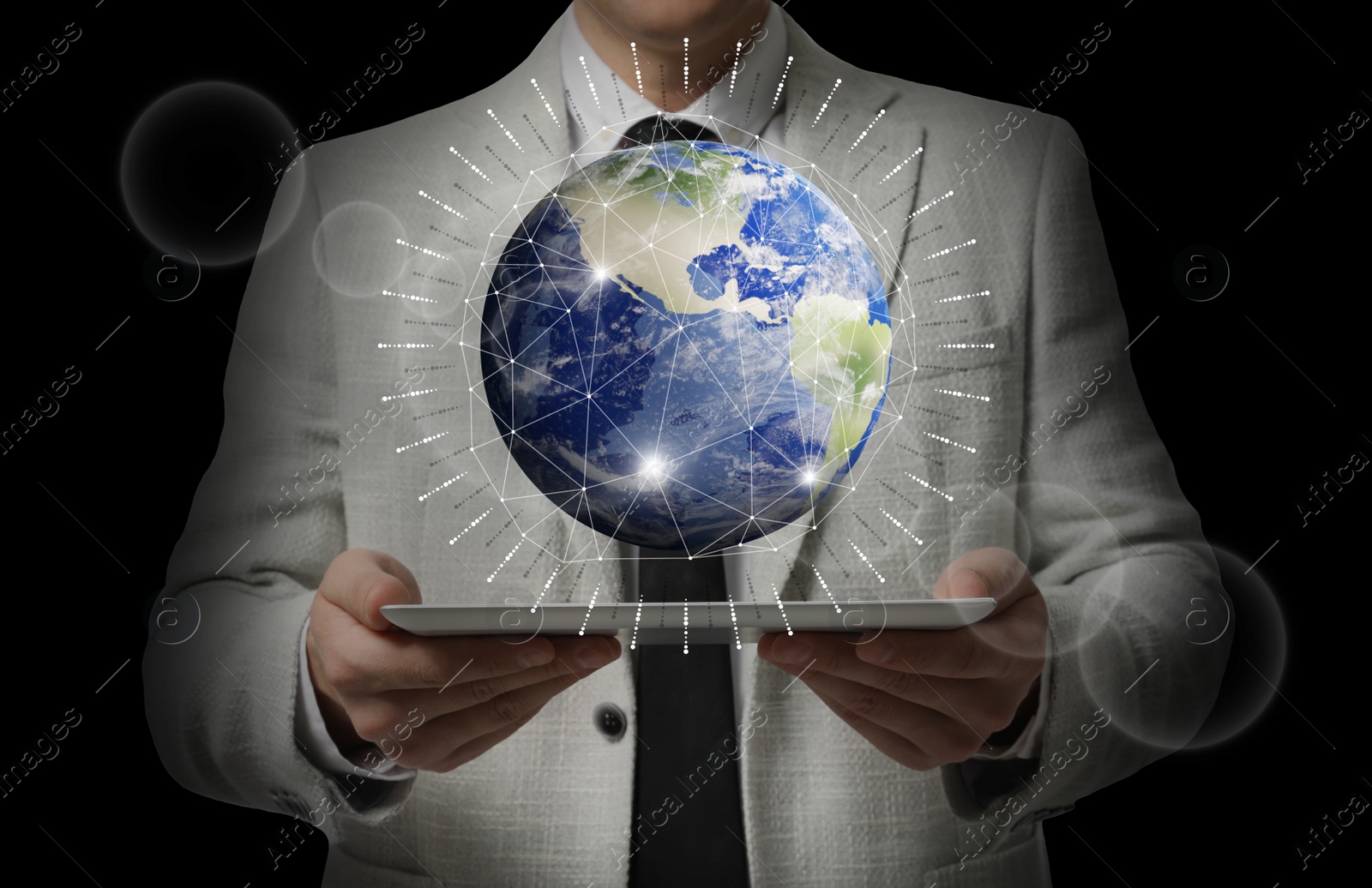 Image of Internet technology concept. Man holding tablet and virtual icon of Earth on dark background