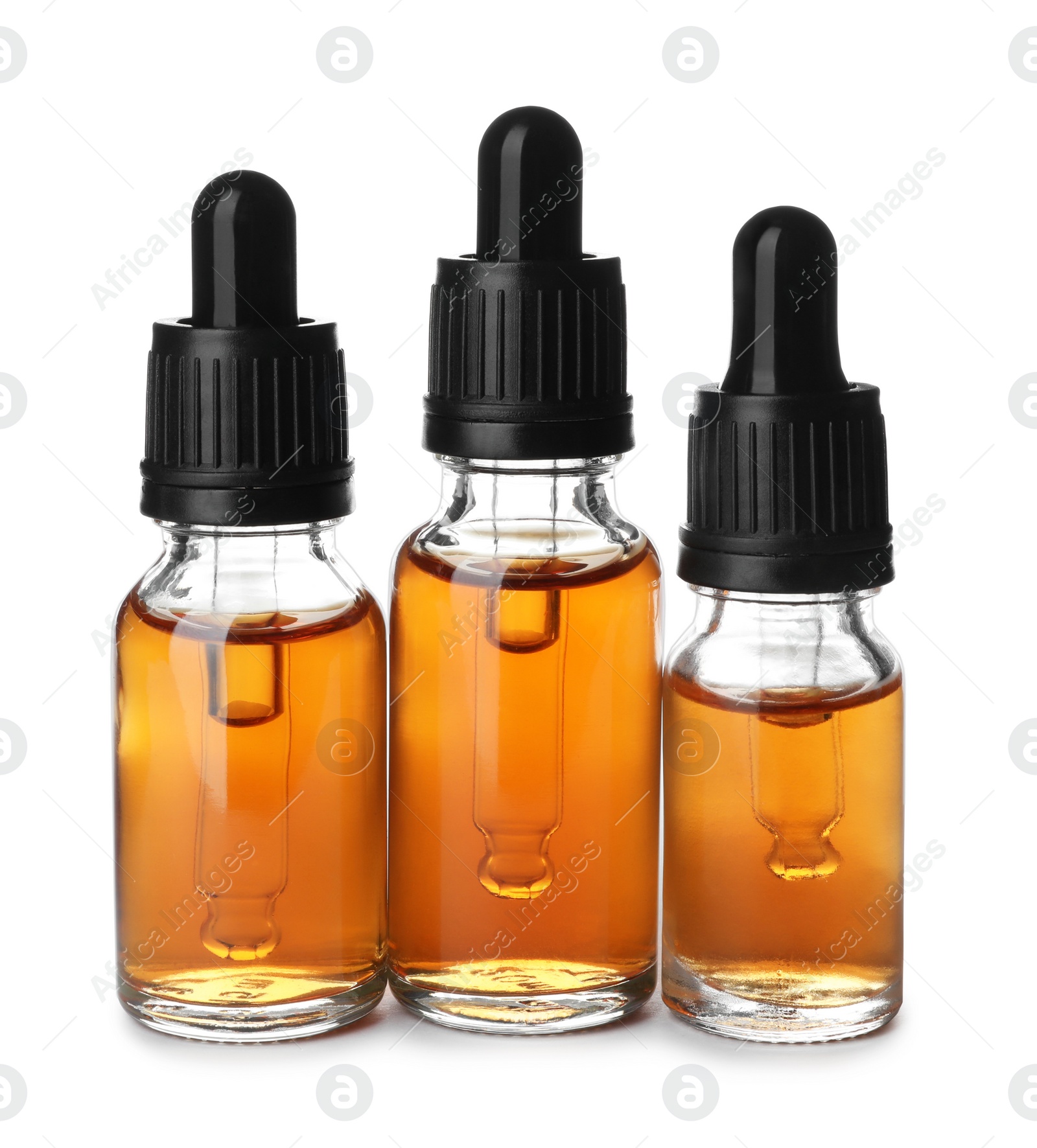 Photo of Bottles of essential oil isolated on white