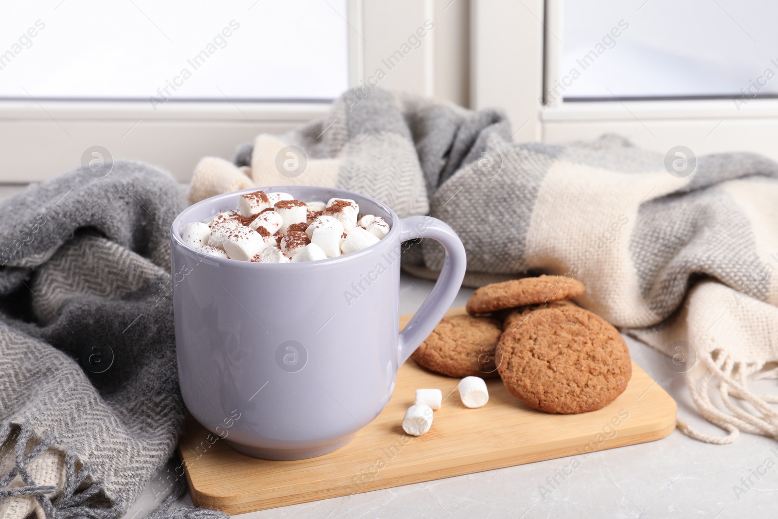 Photo of Composition with cup of cocoa and cookies on windowsill. Winter drink