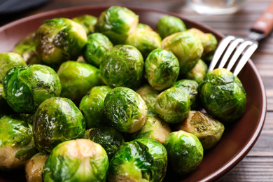 Photo of Roasted Brussels sprouts served on plate, closeup