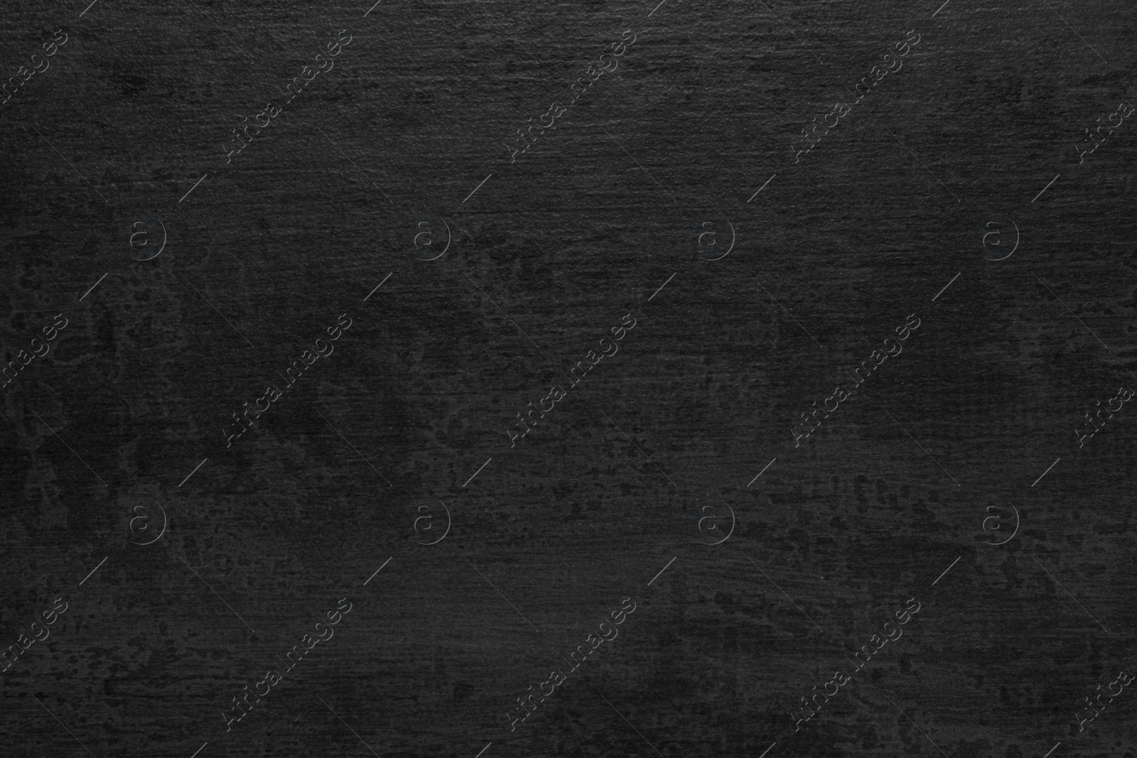 Photo of Texture of black stone surface as background, closeup