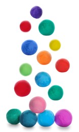 Image of Different colorful play dough falling on white background