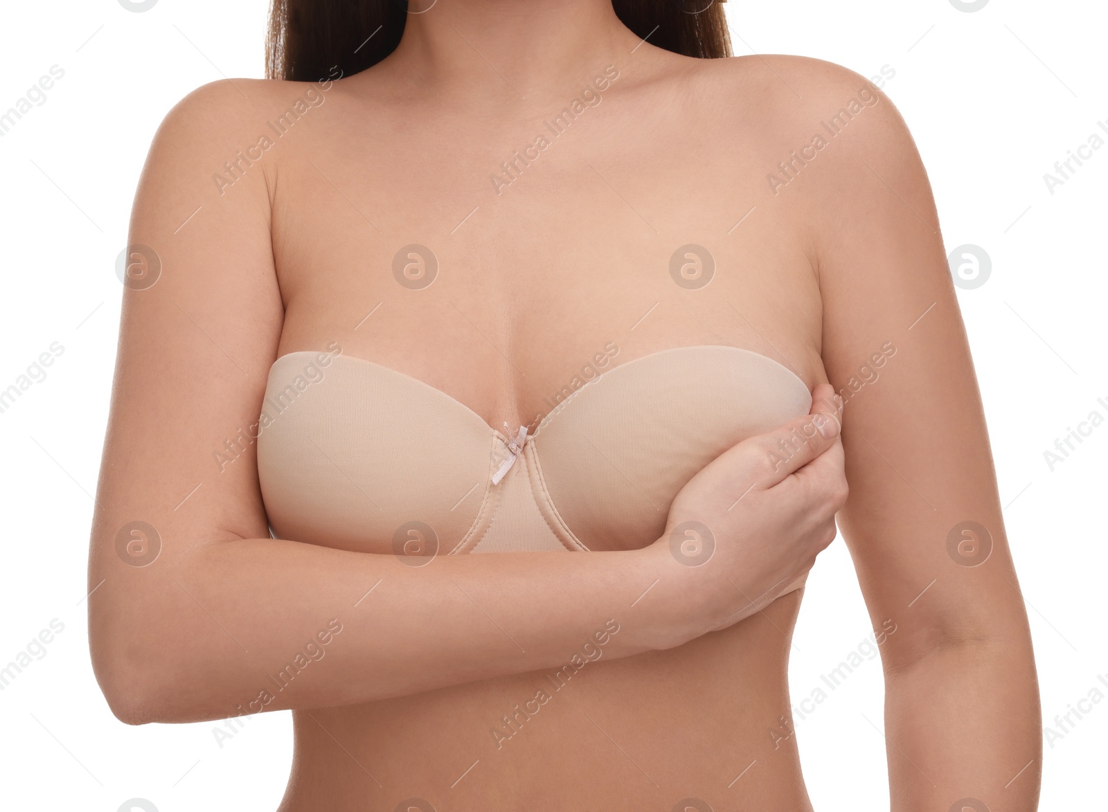 Photo of Mammology. Woman in bra doing breast self-examination on white background, closeup