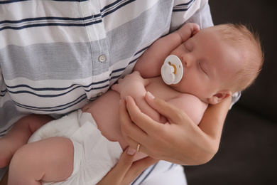 Mother with her newborn baby, closeup view