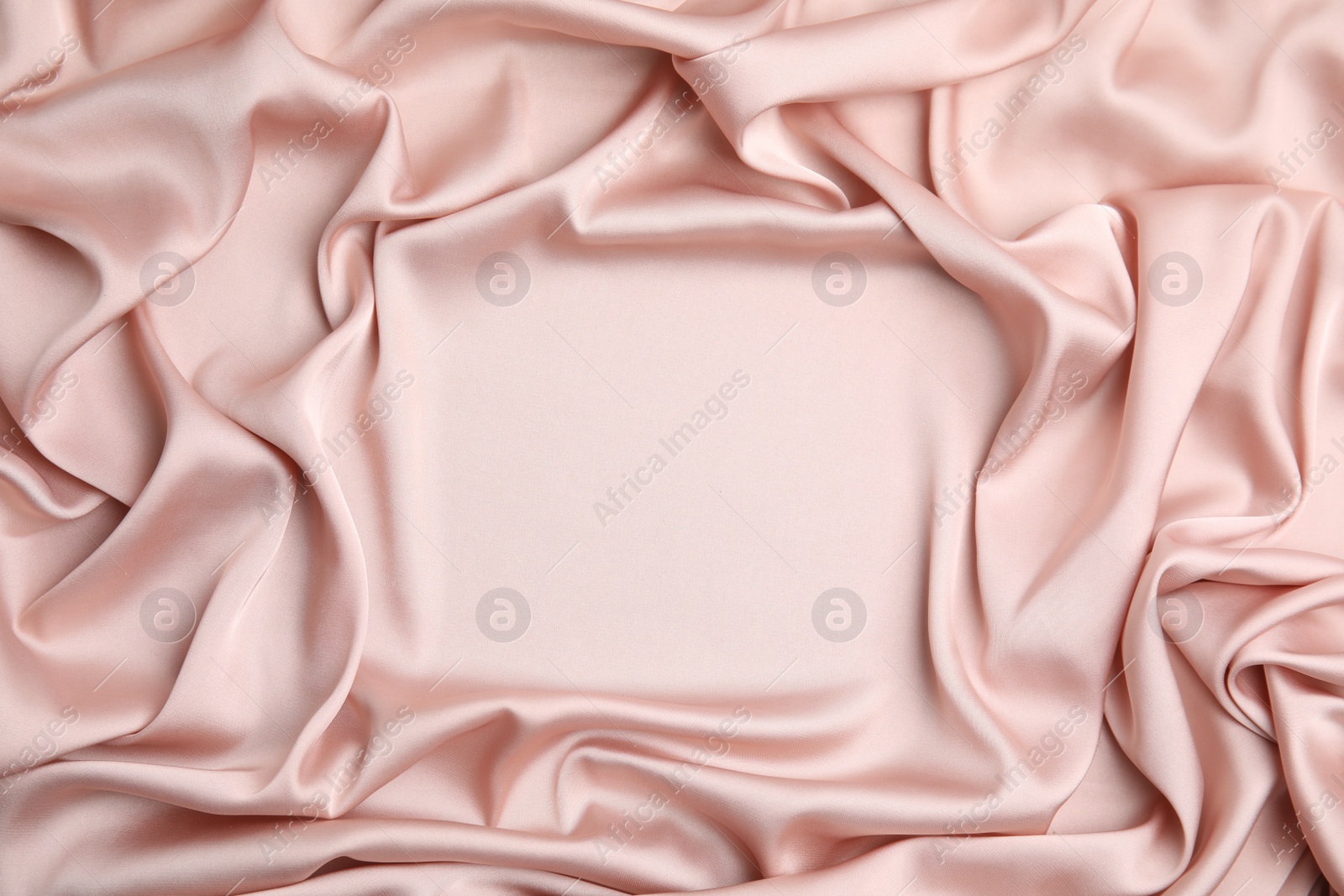 Photo of Texture of delicate pink silk as background, top view