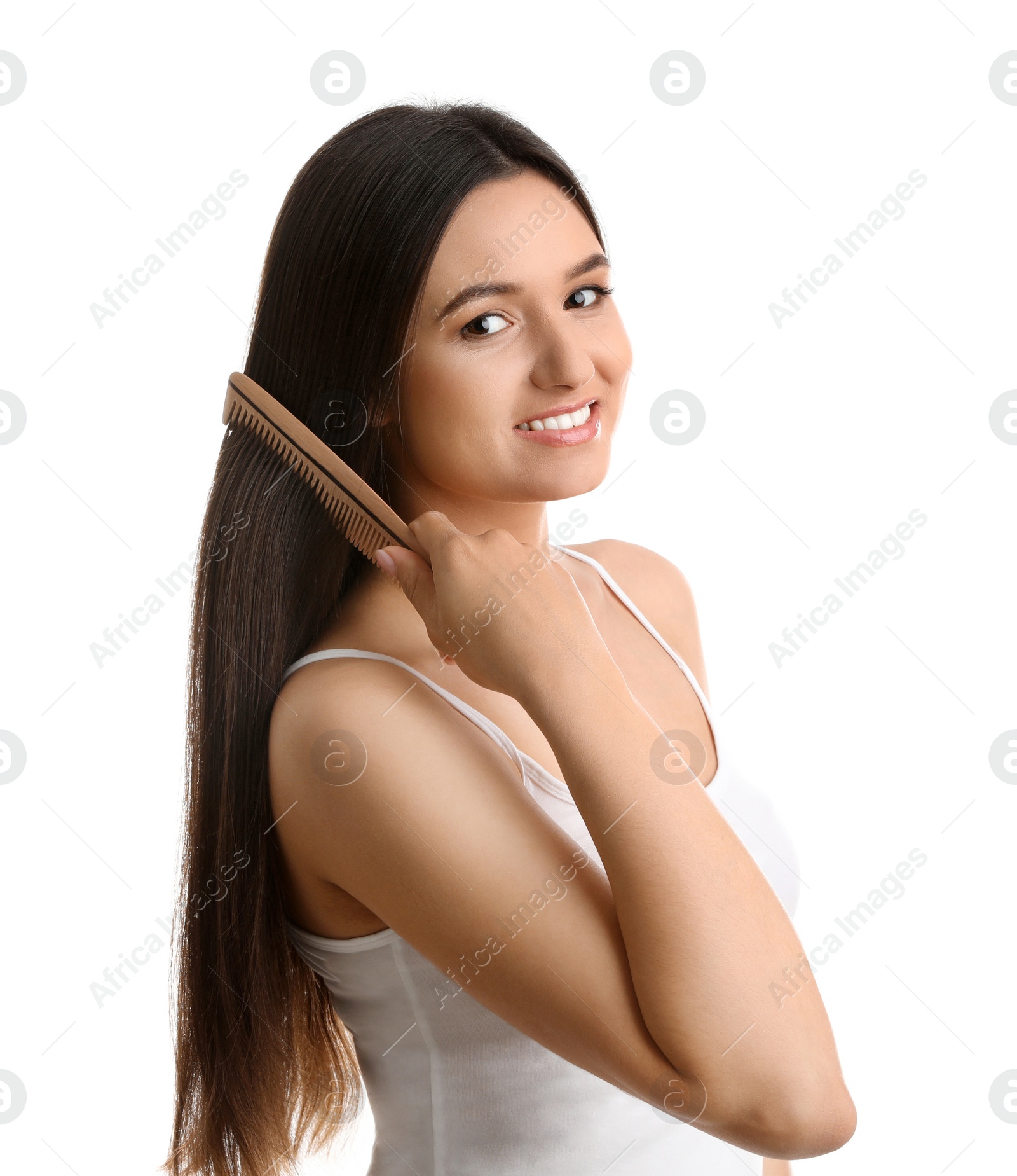 Photo of Beautiful young woman with hair comb on white background