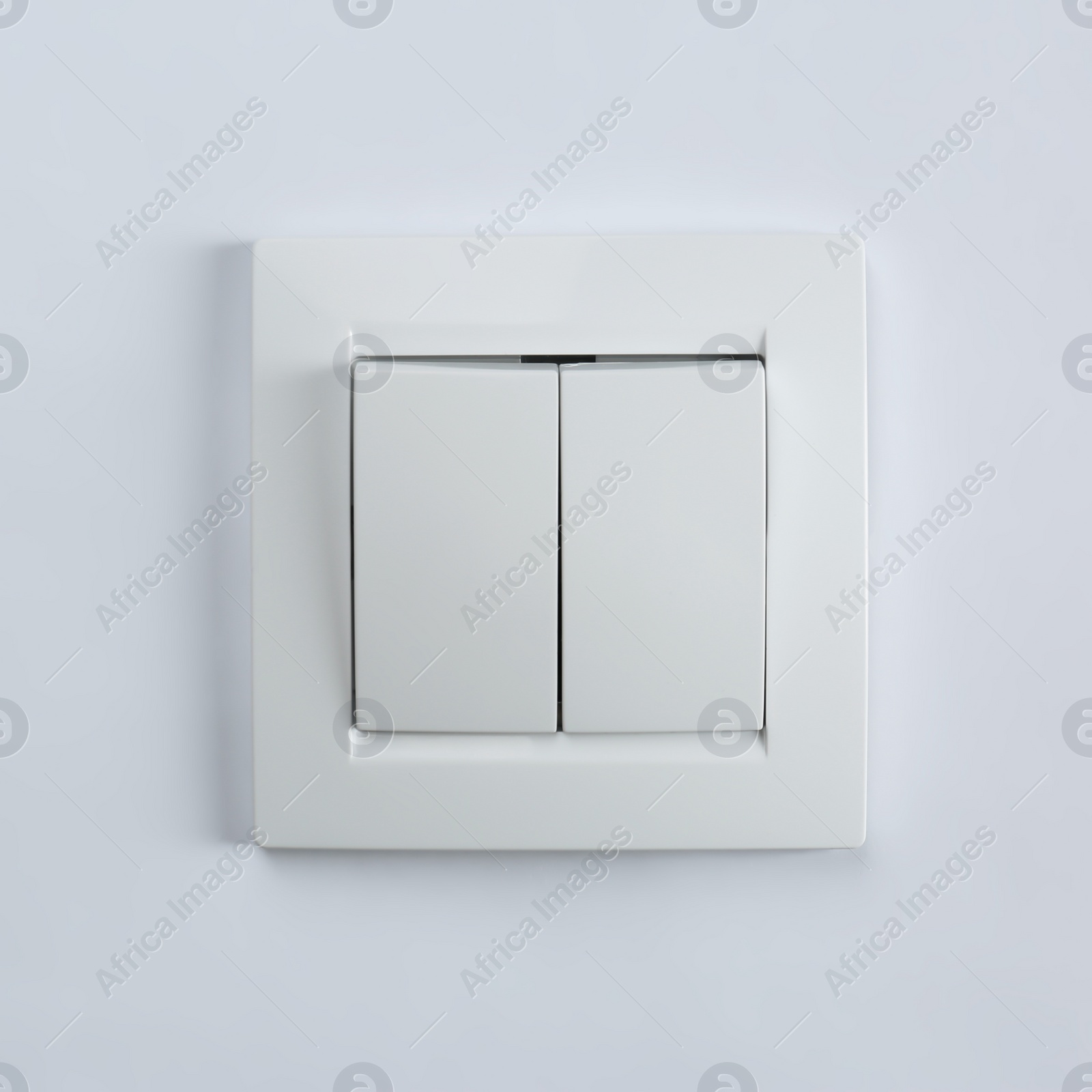Photo of Light switch on white background. Electrician's equipment