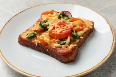 Photo of Tasty pizza toast on grey table, closeup