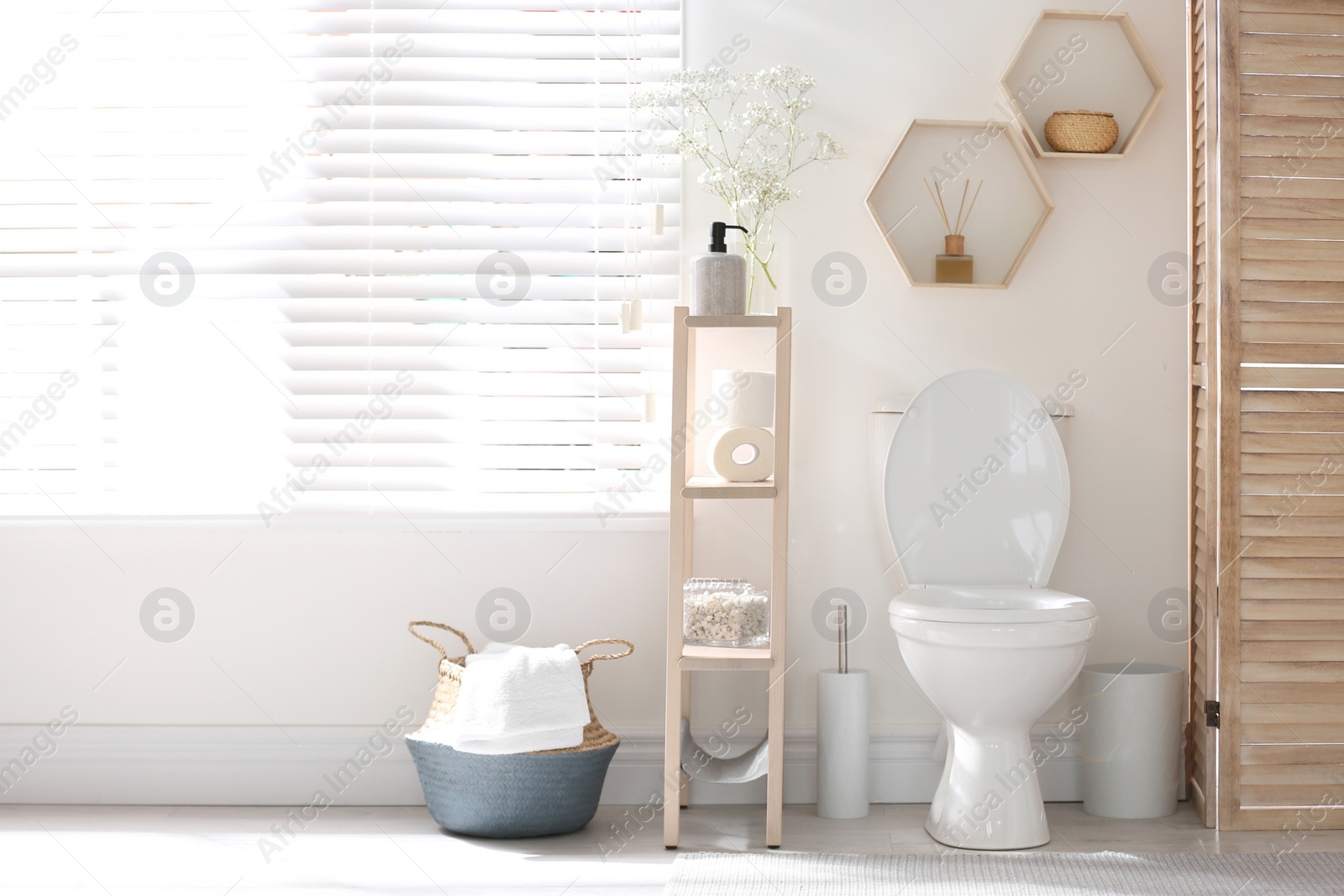 Photo of Modern toilet bowl in stylish bathroom interior