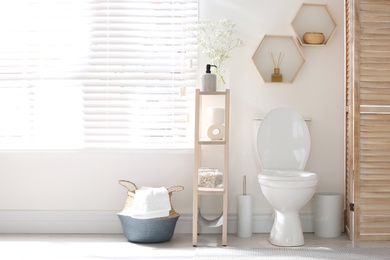 Photo of Modern toilet bowl in stylish bathroom interior