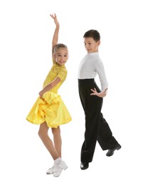 Photo of Beautifully dressed couple of kids dancing on white background