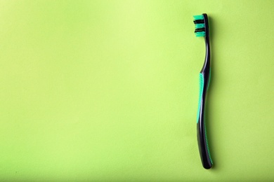 Photo of Manual toothbrush on color background. Dental care