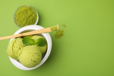 Photo of Tasty matcha ice cream and powder on light green background, flat lay
