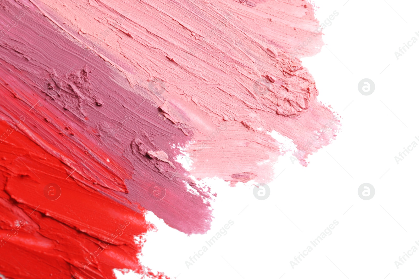 Photo of Strokes of lipstick on white background, top view