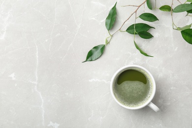 Photo of Flat lay composition with matcha tea and leaves on light background