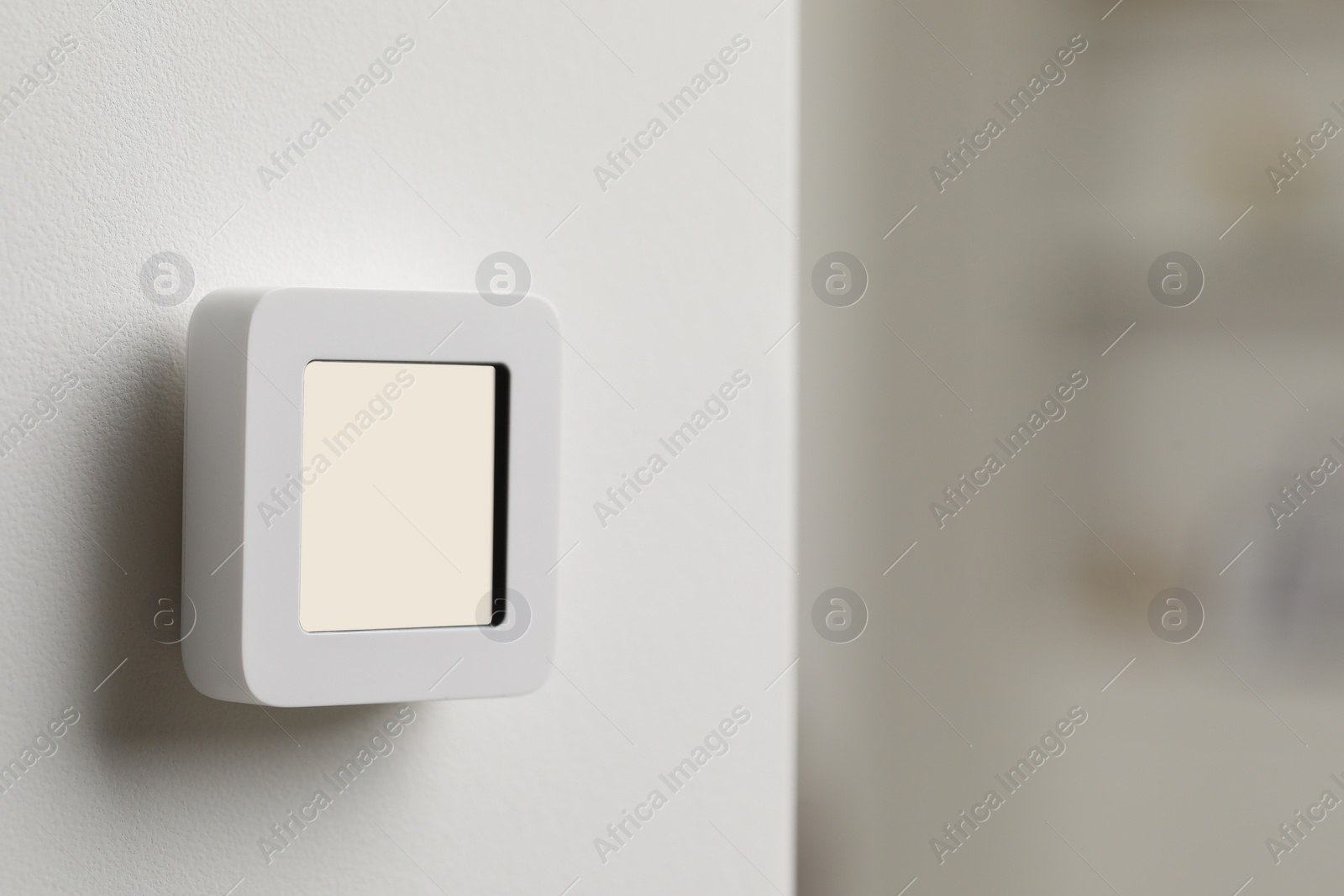 Photo of One thermostat on white wall indoors, space for text. Smart home system