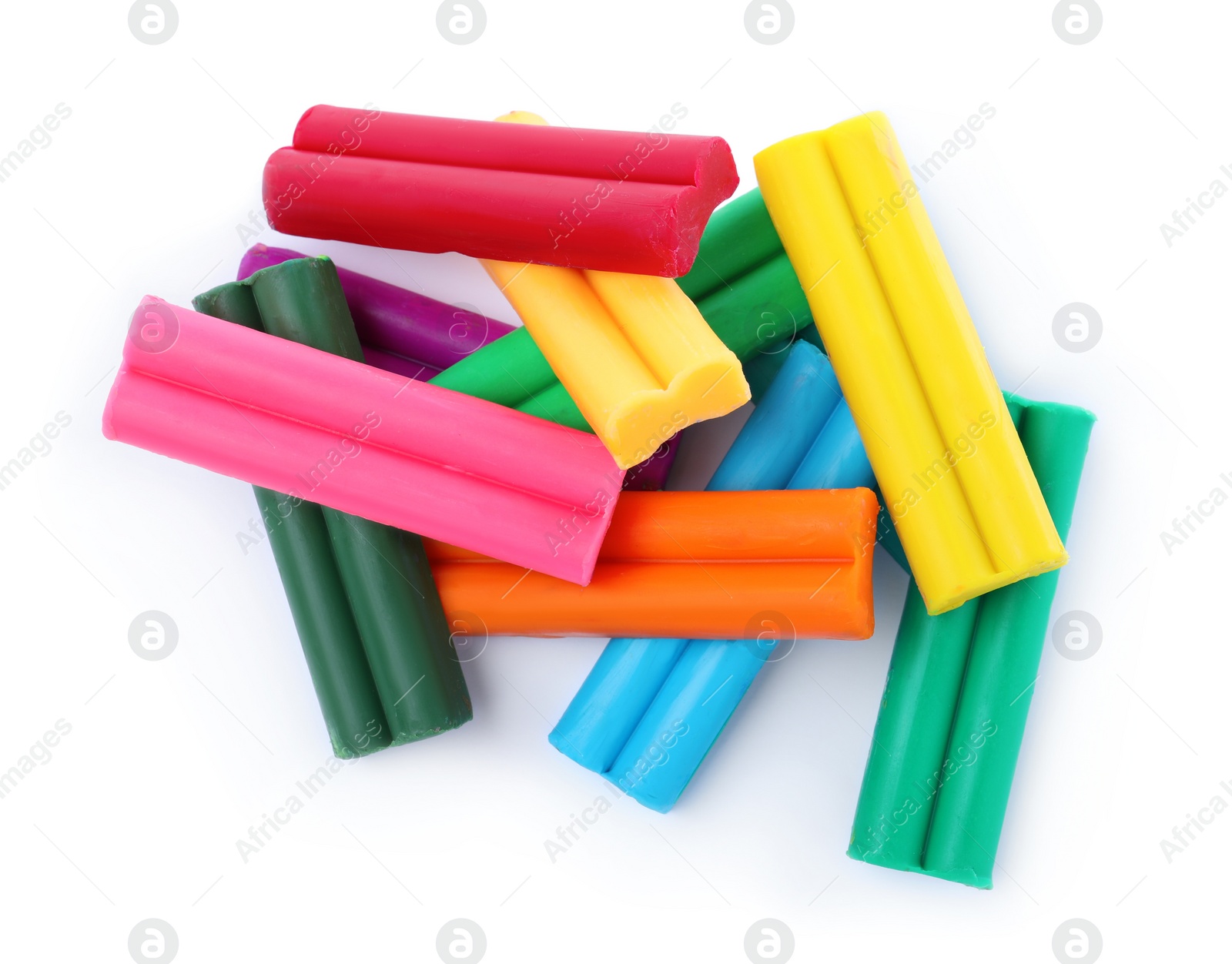 Photo of Many different colorful plasticine pieces on white background, top view