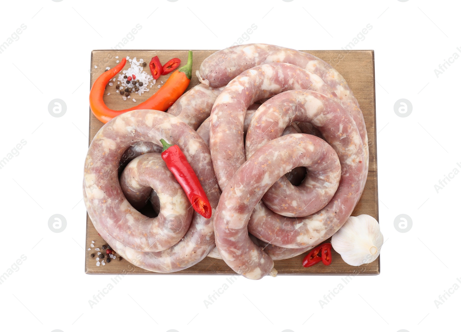 Photo of Board with homemade sausages, garlic, chili and spices isolated on white, top view