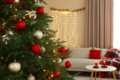 Beautiful Christmas tree decorated with baubles in stylish room. Interior design