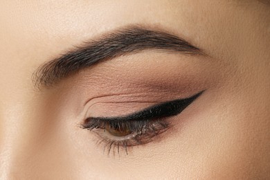 Young woman with beautiful eyebrows, closeup view