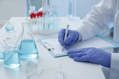 Photo of Scientist working in laboratory, closeup. Medical research