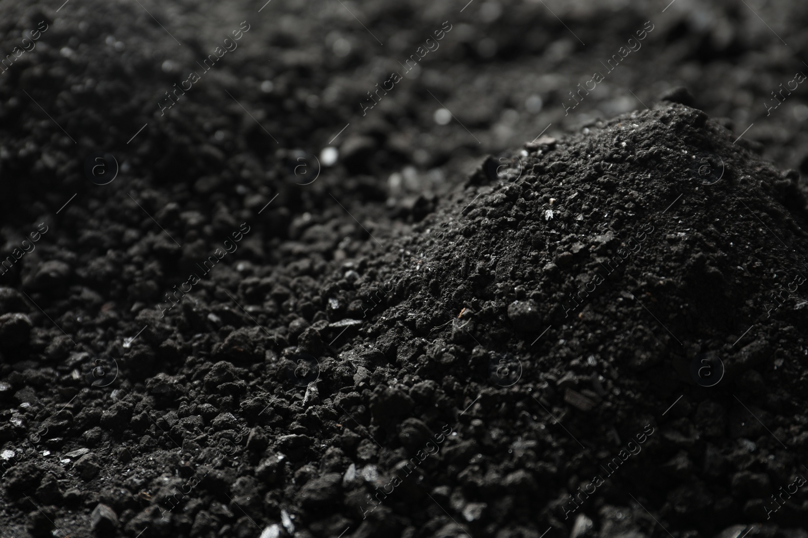 Photo of Black coal as background, closeup. Mineral deposits