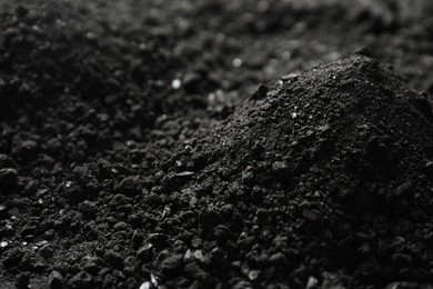 Photo of Black coal as background, closeup. Mineral deposits
