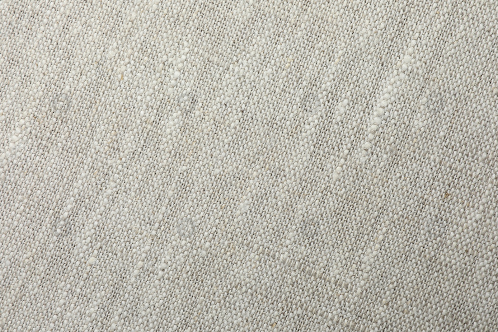 Photo of Texture of light grey fabric as background, top view