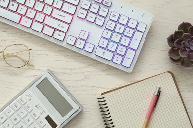 Photo of Flat lay composition with modern RGB keyboard on white wooden table