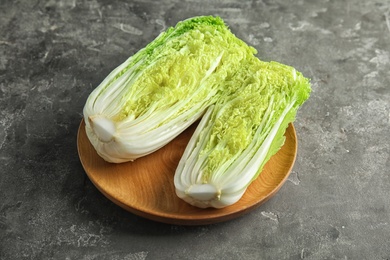 Photo of Plate with fresh sliced cabbage on table