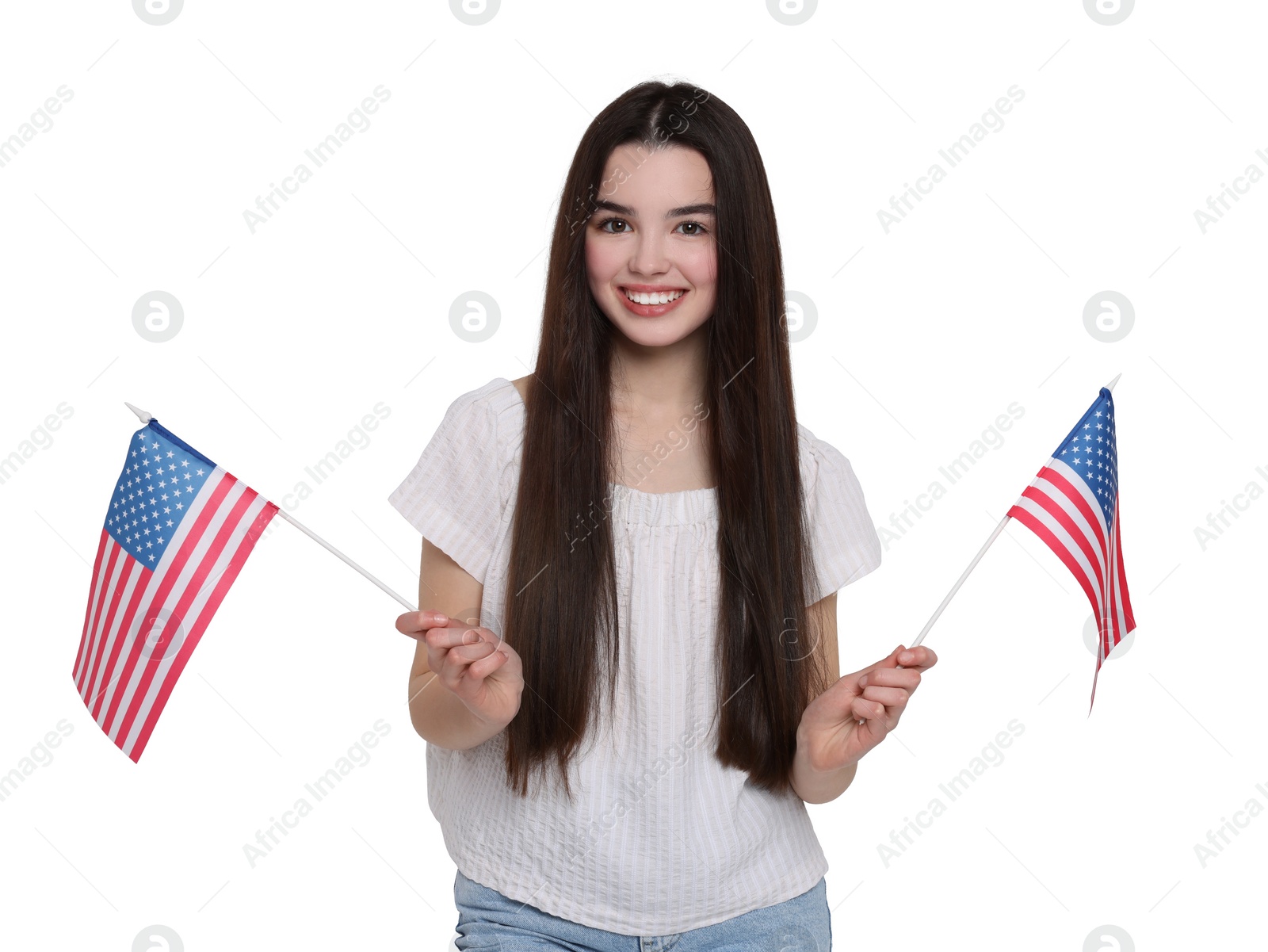 Image of 4th of July - Independence day of America. Happy teenage girl holding national flags of United States on white background