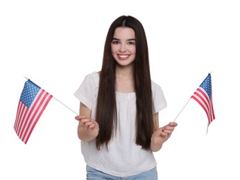 Image of 4th of July - Independence day of America. Happy teenage girl holding national flags of United States on white background